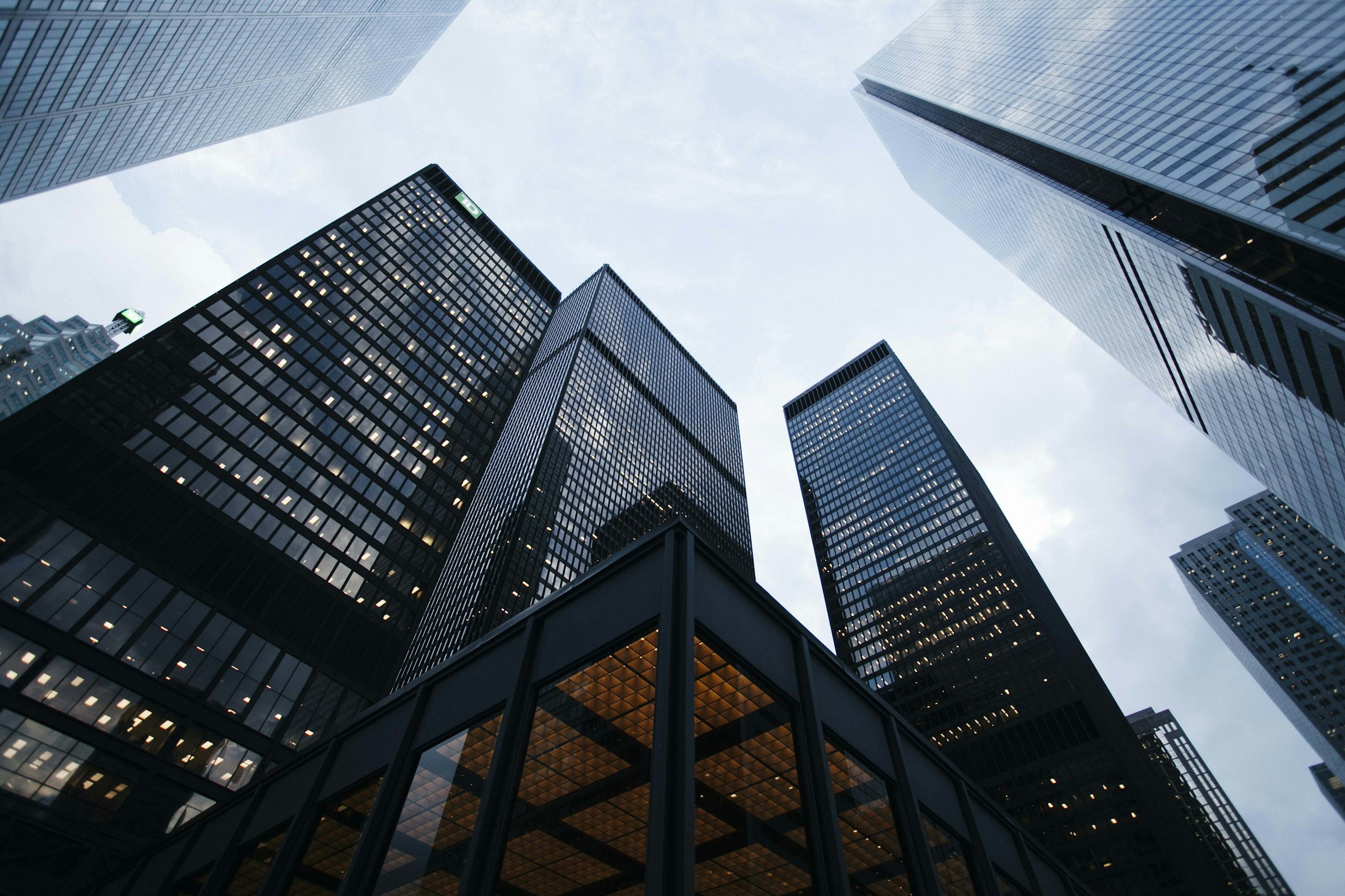 Glass towers rising towards an open sky